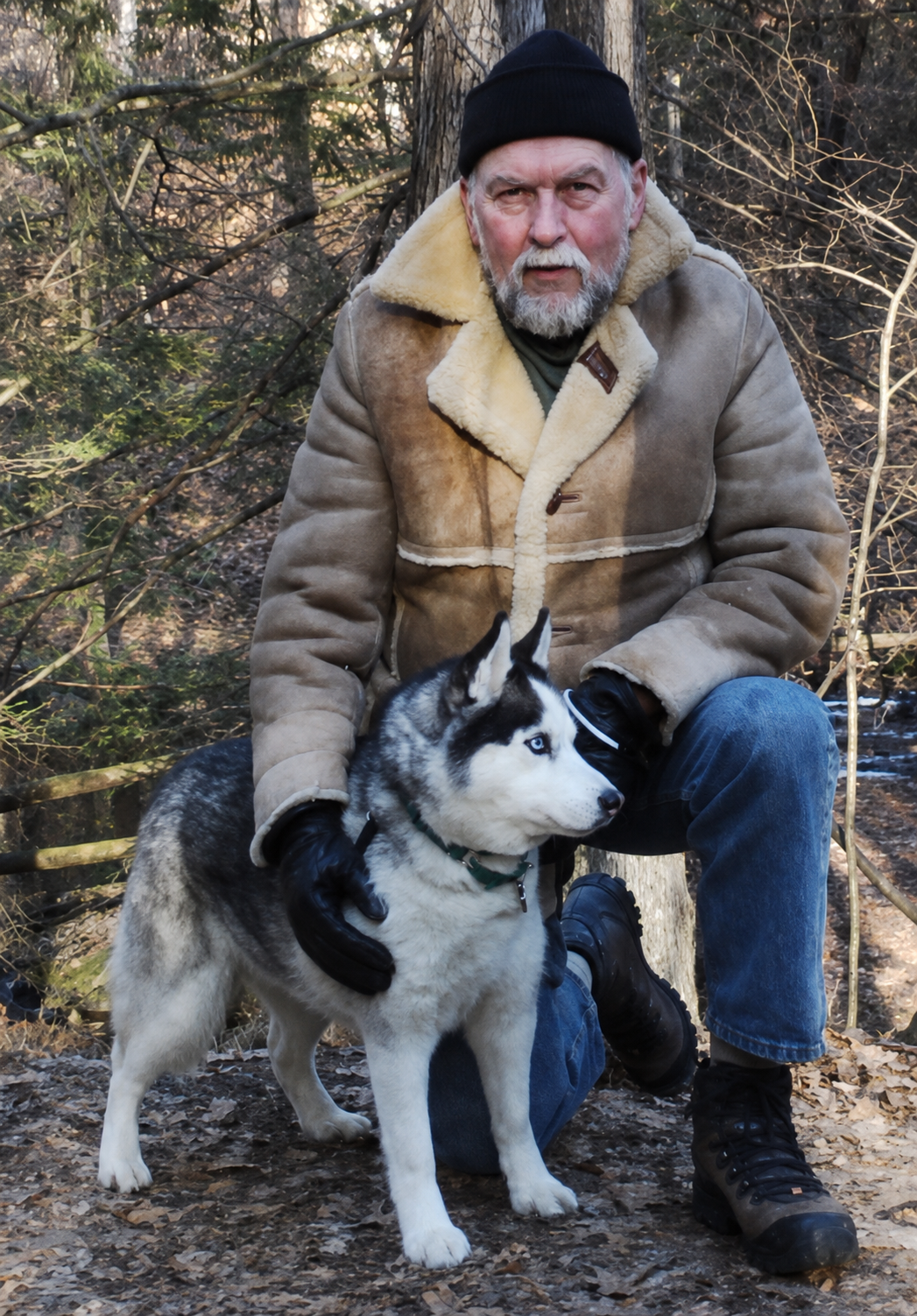 Mike Walling outdoors with his husky